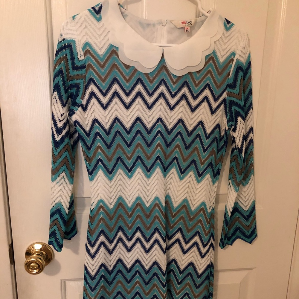 Women’s dress with stripes of shades of blue.